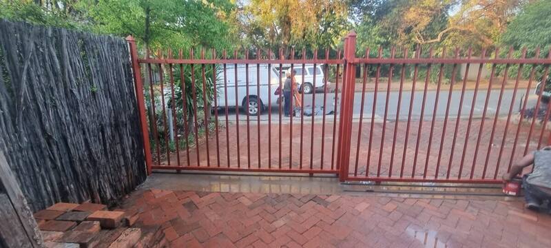 Gate open : clear vehicle access with track set flush in paving
